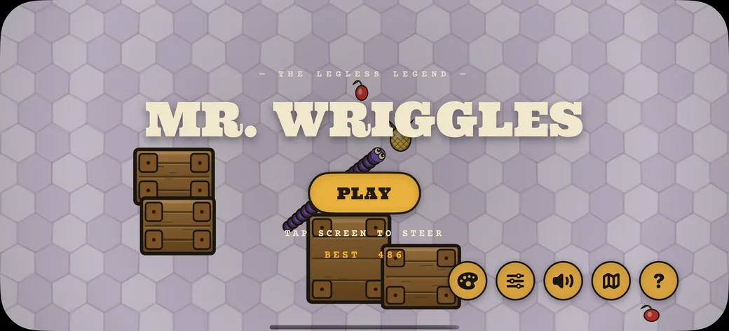 The Mr. Wriggles title screen: the wordmark over a lilac honeycomb field, a purple worm curling past the PLAY button, and a best score of 486.